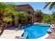 Inviting backyard pool with beautiful landscaping and a spacious patio area, perfect for outdoor living at 408 E Silverwood Dr, Phoenix, AZ 85048