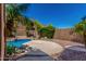 Backyard pool area with mature landscaping, patio, and privacy wall at 408 E Silverwood Dr, Phoenix, AZ 85048