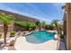 Inviting private pool surrounded by lush desert landscaping and privacy features at 408 E Silverwood Dr, Phoenix, AZ 85048