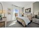 Inviting bedroom featuring a cozy bed, neutral decor, and soft natural light at 42440 W Peters Dr, Maricopa, AZ 85138
