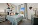 Vibrant bedroom with dinosaur decor and a window view at 42440 W Peters Dr, Maricopa, AZ 85138