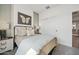 Comfortable bedroom with a double bed, soft lighting, and minimalist design at 42440 W Peters Dr, Maricopa, AZ 85138
