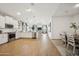 Spacious open-concept kitchen with stainless steel appliances and wood-look flooring at 42440 W Peters Dr, Maricopa, AZ 85138