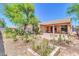 Relaxing backyard with a fire pit, hammock, and cozy covered patio at 4323 S Ranger Trl, Gilbert, AZ 85297