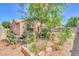 An inviting backyard garden featuring sunflowers and a concrete planter at 4323 S Ranger Trl, Gilbert, AZ 85297