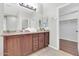 Bathroom featuring dual sinks, granite countertops, and a large mirror for convenience and style at 4323 S Ranger Trl, Gilbert, AZ 85297