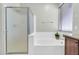 Relaxing bathroom featuring a soaking tub, separate shower, and natural light from the window at 4323 S Ranger Trl, Gilbert, AZ 85297