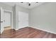 A spacious bedroom with a closet and wood floors at 4323 S Ranger Trl, Gilbert, AZ 85297