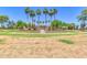 Landscaped community park featuring walking paths, palm trees, and a central gazebo, ideal for recreation and relaxation at 4323 S Ranger Trl, Gilbert, AZ 85297