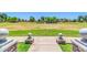 Expansive community park featuring grassy areas and meticulously maintained landscaping, under a clear blue sky at 4323 S Ranger Trl, Gilbert, AZ 85297
