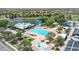 Beautiful community pool with a lap pool, kiddie pool, lounging areas, and a view of a scenic lake at 4323 S Ranger Trl, Gilbert, AZ 85297
