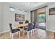 Bright dining area with modern table, chairs, and sliding glass doors to the backyard at 4323 S Ranger Trl, Gilbert, AZ 85297