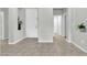 Neutral hallway featuring tiled floors, white doors, and decorative niches at 4323 S Ranger Trl, Gilbert, AZ 85297