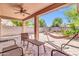 Cozy outdoor patio with comfortable seating and a cooling ceiling fan at 4323 S Ranger Trl, Gilbert, AZ 85297