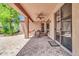 The covered patio includes a ceiling fan, and a paver floor offering an outdoor space at 4323 S Ranger Trl, Gilbert, AZ 85297