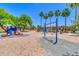 Bright community playground with slides, swings, and shaded picnic areas set amongst lush greenery at 4323 S Ranger Trl, Gilbert, AZ 85297