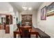 Traditional dining room featuring a long wood table, bench, and a classic wood hutch at 4403 N 56Th Dr, Phoenix, AZ 85031