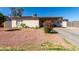 Quaint single-story home with desert landscaping and a covered front patio at 4403 N 56Th Dr, Phoenix, AZ 85031