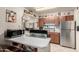 Open kitchen design with stainless steel appliances, white countertops, and seamless flow to living area at 4403 N 56Th Dr, Phoenix, AZ 85031