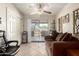 Cozy living room with sliding glass door, ceiling fan and comfortable seating at 4403 N 56Th Dr, Phoenix, AZ 85031