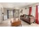 Bright living room with tile floors, natural lighting, and classic decor at 4403 N 56Th Dr, Phoenix, AZ 85031
