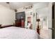 Comfortable main bedroom showing television, dresser, and en-suite bathroom access at 4403 N 56Th Dr, Phoenix, AZ 85031