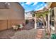 This landscaped backyard includes a covered patio and desert features, perfect for relaxing or entertaining guests at 450 W Mountain Sage Dr, Phoenix, AZ 85045