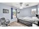 Cozy bedroom with natural light, offering a workspace and integrated storage beneath the bed at 450 W Mountain Sage Dr, Phoenix, AZ 85045