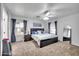 Spacious bedroom features a king bed, plush carpet, and abundant natural light at 450 W Mountain Sage Dr, Phoenix, AZ 85045