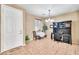 Bright dining room with a dark desk, a small table, and a view to the yard at 450 W Mountain Sage Dr, Phoenix, AZ 85045