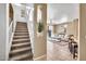 Staircase flowing into living room with tile flooring and sliding glass doors at 450 W Mountain Sage Dr, Phoenix, AZ 85045
