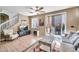 Relaxing living room with tile floor and a sliding glass door to the backyard at 450 W Mountain Sage Dr, Phoenix, AZ 85045