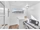 Bright stairway landing featuring a keyboard, small window, and white walls at 450 W Mountain Sage Dr, Phoenix, AZ 85045