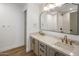 Elegant bathroom features double vanity with marble countertop, gold fixtures, and modern mirror at 5520 E Muriel Dr, Scottsdale, AZ 85254