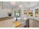 Bright kitchen features a large island, farmhouse sink, and views of the backyard at 5520 E Muriel Dr, Scottsdale, AZ 85254