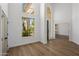 Bright living room boasts soaring ceilings, lots of natural light, and wood-look floors at 5520 E Muriel Dr, Scottsdale, AZ 85254