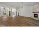Open concept features lots of windows, wood-look floors, and access to a modern fireplace at 5520 E Muriel Dr, Scottsdale, AZ 85254