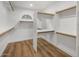 Walk-in closet with custom shelving and storage, providing ample space for organization at 5520 E Muriel Dr, Scottsdale, AZ 85254