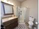 Bathroom featuring a vanity with cabinets, a toilet, and a glass enclosed shower at 591 S Ironstone Dr, Apache Junction, AZ 85119