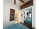 Bedroom featuring a closet with mirrored doors, and built in cabinets for storage at 591 S Ironstone Dr, Apache Junction, AZ 85119