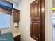 Bedroom with window featuring blind coverings and built in cabinets for storage, and a lamp at 591 S Ironstone Dr, Apache Junction, AZ 85119