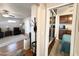 Comfortable bedroom with built-in cabinets and drawers, and a view to the living room at 591 S Ironstone Dr, Apache Junction, AZ 85119
