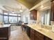 Inviting kitchen overlooking the living area, featuring tile floors and ample counter space at 591 S Ironstone Dr, Apache Junction, AZ 85119
