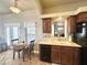 Functional kitchen features a quaint breakfast table and convenient access to the outdoor patio at 591 S Ironstone Dr, Apache Junction, AZ 85119