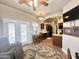 Comfortable living area connecting to the kitchen, featuring tile flooring and lots of natural light at 591 S Ironstone Dr, Apache Junction, AZ 85119