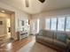 Living room with a couch, area rug, and cabinet with an entrance to the home's front door at 591 S Ironstone Dr, Apache Junction, AZ 85119