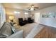 Wide shot of living room including wood floors, ceiling fan, and neutral paint colors at 591 S Ironstone Dr, Apache Junction, AZ 85119