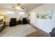 Cozy living room with hardwood floors, a ceiling fan, neutral colors, and plenty of seating at 591 S Ironstone Dr, Apache Junction, AZ 85119