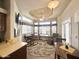 Cozy living room featuring a desk, recliner, and large windows for ample natural light at 591 S Ironstone Dr, Apache Junction, AZ 85119