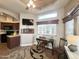 Cozy living room with a desk, chairs, and a TV at 591 S Ironstone Dr, Apache Junction, AZ 85119